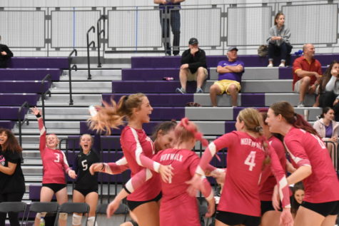The Norwalk varsity volleyball team celebrates on Oct. 4. The team said they have lots to be proud of this season.
