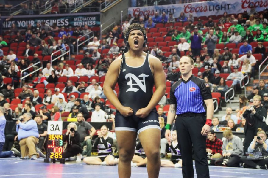 Maddux Borcherding-Johnson flexes after winning the state final for the 285 weight class to become a state champion on Friday, February 17th. Maddux will be playing football for the University of Iowa next year. 