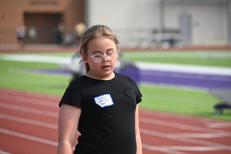 Lakewood fourth-grader Lilly Rattray rests after her race at the Hershey Track Meet on Monday, May 22. Many students sign up for multiple races throughout the event.