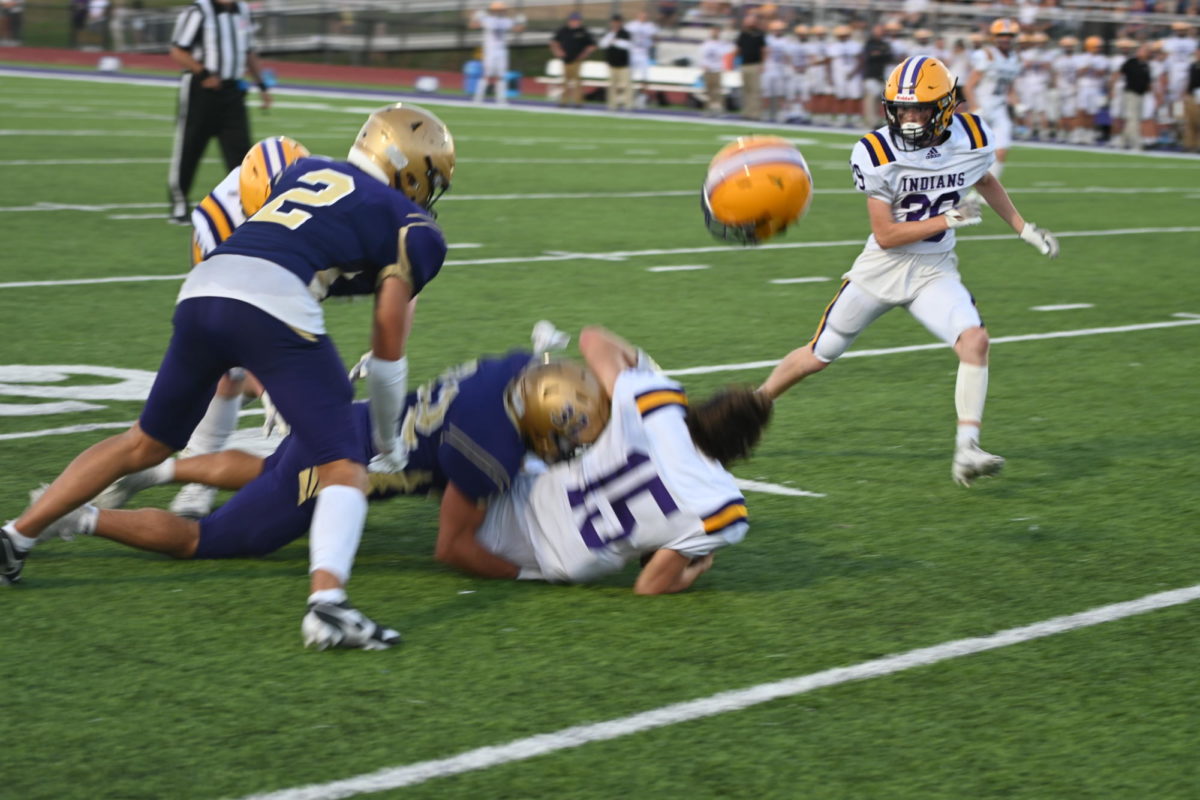 Will Clark makes a big hit on Indianola quarterback Andrew DeWall on Friday night, Sept. 1, in Warrior Stadium. Will Clark had 11 tackles, three tackles for loss and an interception. 