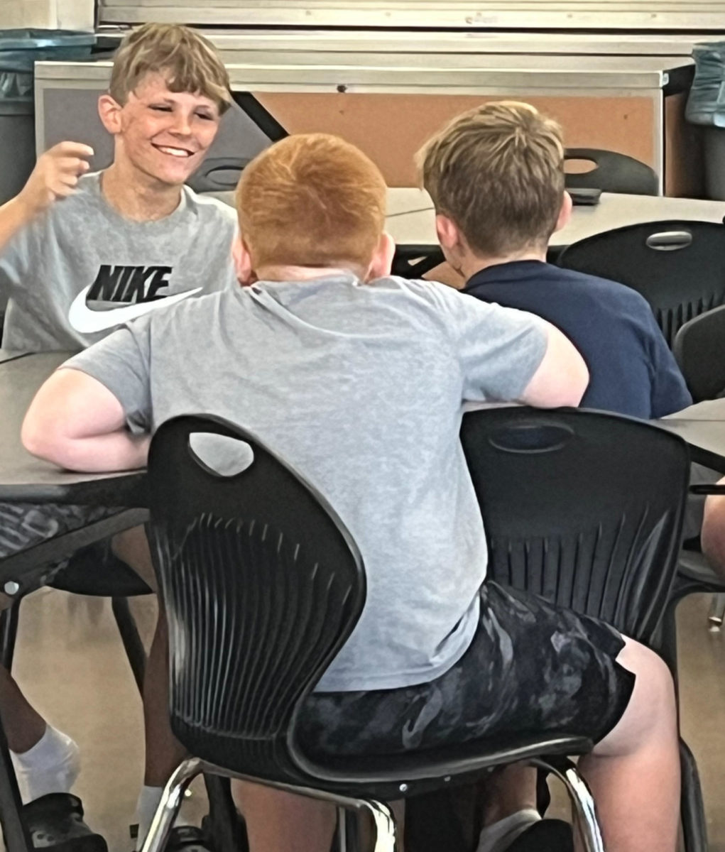 Middle school students share a laugh on Tuesday, Aug. 29, in the cafeteria. The middle school students and the rest of their peers are currently in third period study hall. 