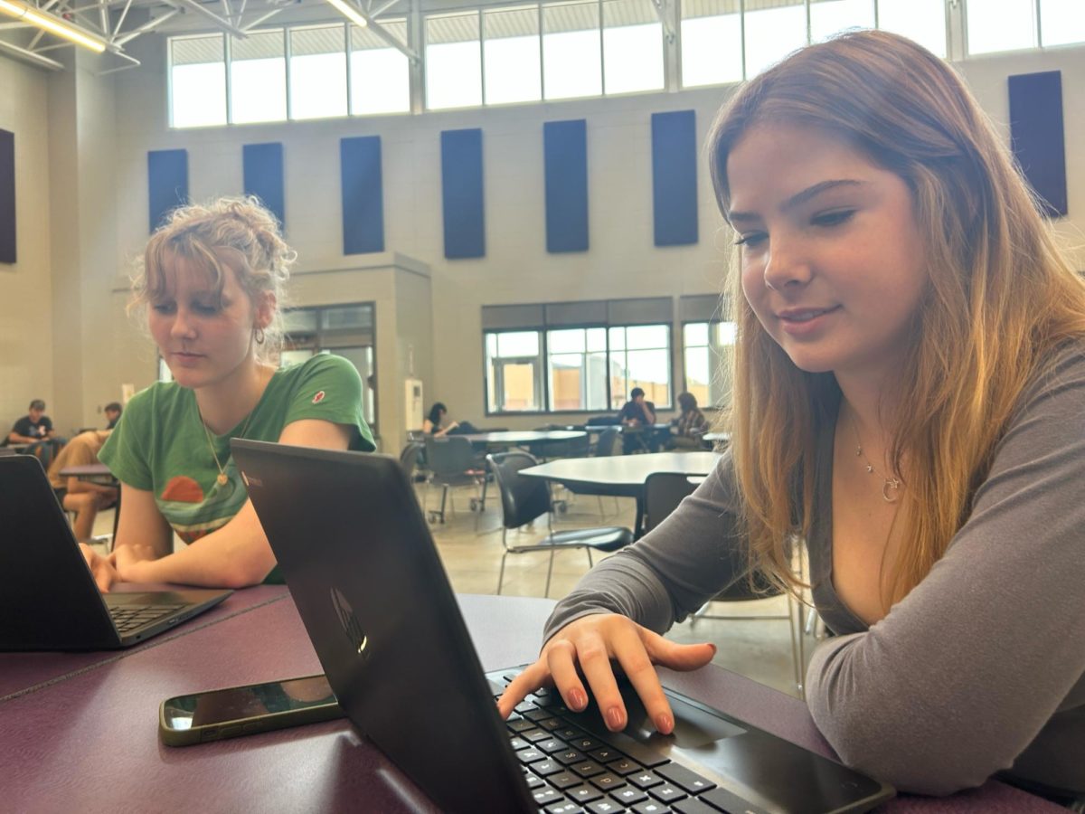 Brooke Kimball (left) and Alaynah Perry work on DMACC classes on Tuesday, Aug. 29, in the Warrior Zone. Kimball said she is taking Environmental Science this semester, where she discusses human impacts on the environment.
