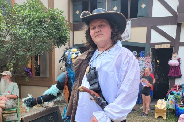 Jack Shelledy poses in costume at the Sleepy Hollow Renaissance Faire on Sept. 10 as a performer photobombs. The last weekend of the Fall Faire is on Sept. 16 and 17.