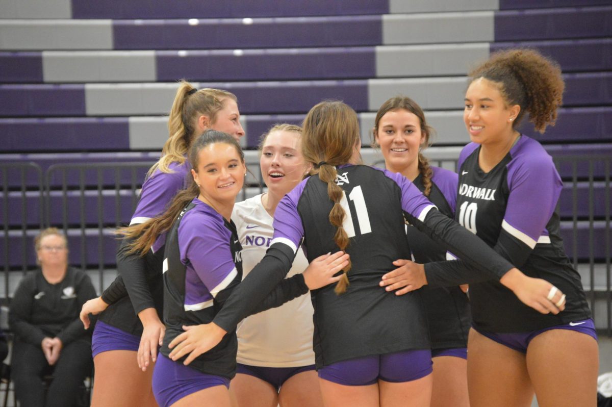 The Norwalk Volleyball Team celebrates their win against Carlisle on Thursday, Oct. 19. 