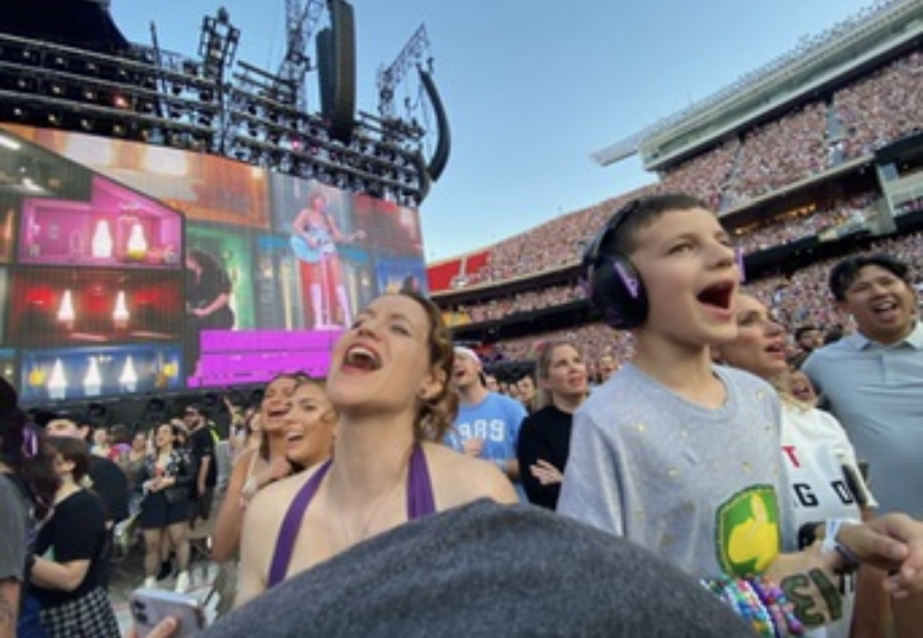 Norwalk High School librarian Beth Grafft and her son enjoy a Taylor Swift concert in Kansas City in July.  Taylor Swift: The Eras Tour concert movie will begin showing at Flix BrewHouse on Friday, Oct. 13.