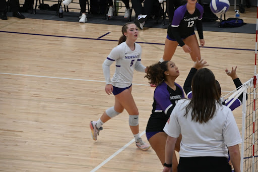 Seniors Grace Dehmer (left) and Ava Johnson chase the ball on Thursday, Oct. 19. Tonight the Norwalk Volleyball Team will play at North Polk for a chance to go to state for the first time in program history.