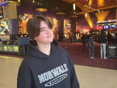 Rylee Campbell waits for her friends to arrive so they can watch ”Five Nights at Freddys” at the movie theater. Campbell is a fan of horror movies though she said she prefers psychological horror. Her favorite horror movies are “The Shining” and “The Village.