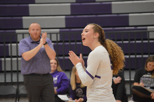 Senior Grace Dehmer cheers on her team in the semi-finals on Thursday, Oct. 19. The Norwalk Volleyball Team has the chance to go to state for the first time in program history.