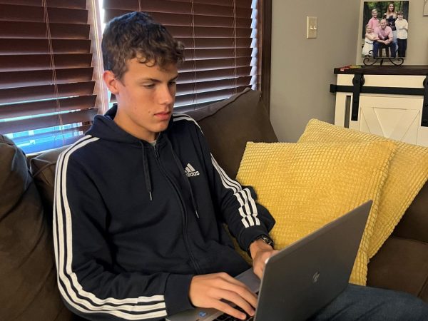 Logan Plourde studies in his home on Thursday, Oct. 26. Logan was one of 16,000 students across America and the only Norwalk student selected this year to be a National Merit Scholarship Semifinalist.
