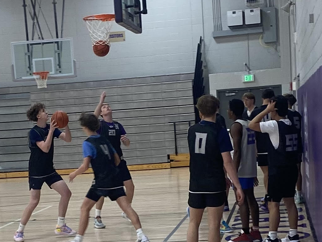 The Norwalk Warriors Basketball Team practices on Monday, Nov. 27, in the NPECC. The team will play its home opener tonight at 7:45 p.m. against Ballard.