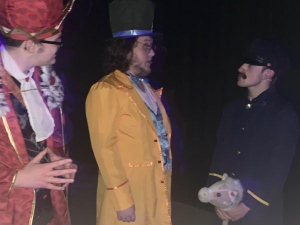 Charlie Trilk (left), Jack Shelledy and Noah Fox hang out backstage on Thursday, Nov. 30, during a dress rehearsal for “Alice in Wonderland.” Shows will be at 7 p.m. on Friday and Saturday, Dec. 1 and 2. 