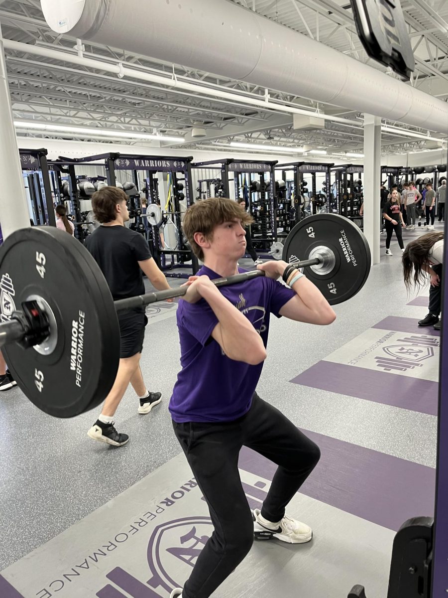 Sophomore Cael Bemis does a hang clean while at after-school lifting. Bemis is a member of the football and wrestling teams.