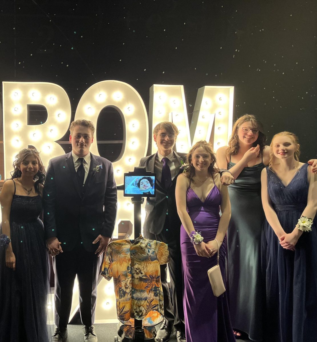 Norwalk students gather with senior Jayden Overton attending prom virtually on Saturday, April 6, at the Science Center of Iowa. Friends of Overton made it possible for him to attend his senior Prom despite being unable to make it.