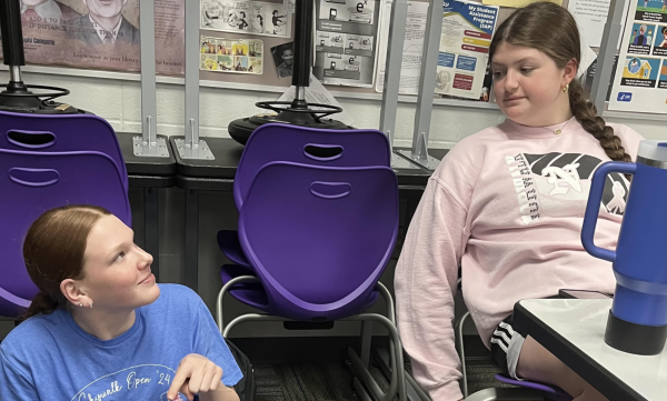 Mallory Betts (left) and Piper Weldon sit in Warrior Time on May 16. They were talking about their summer plans of playing beach volleyball, swimming, camping and hanging out with friends. 