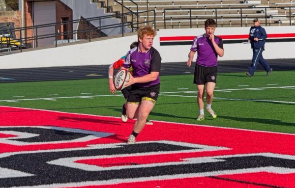 Wade Bedwell (left) and Matthew Handley play during a game this rugby season at Fort Dodge High School. The rugby season starts in March and lasts for 10 weeks including seven game weeks.