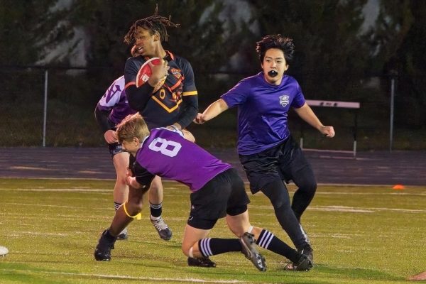 Dulguun Batzaya (right) plays in a rugby game this season. Batzaya participated in The Norwalk Rugby Club along with various activities during his year at Norwalk.
