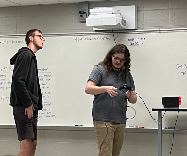 Ethan Crees and Leo Lankford work together on setting up for the first day of E-Sports Club this school year. Leo says he hopes for "more variety" for the E-Sports Club this year.