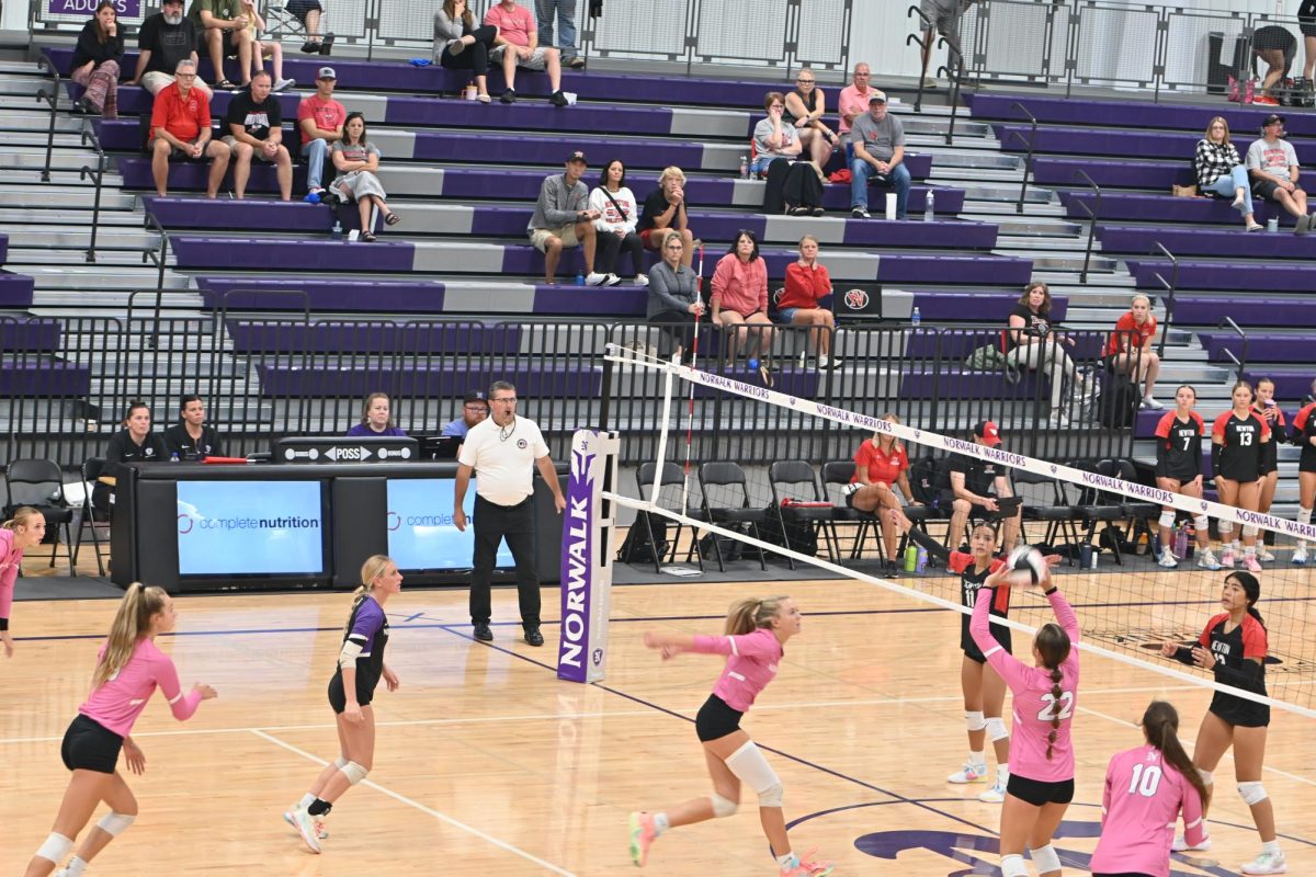 Hadley Michael sets the ball for Jillian Hammond to spike during the game against Newton on Tuesday, Sept. 20, in the NPECC. Norwalk will face Pella tonight at 7:30 p.m.