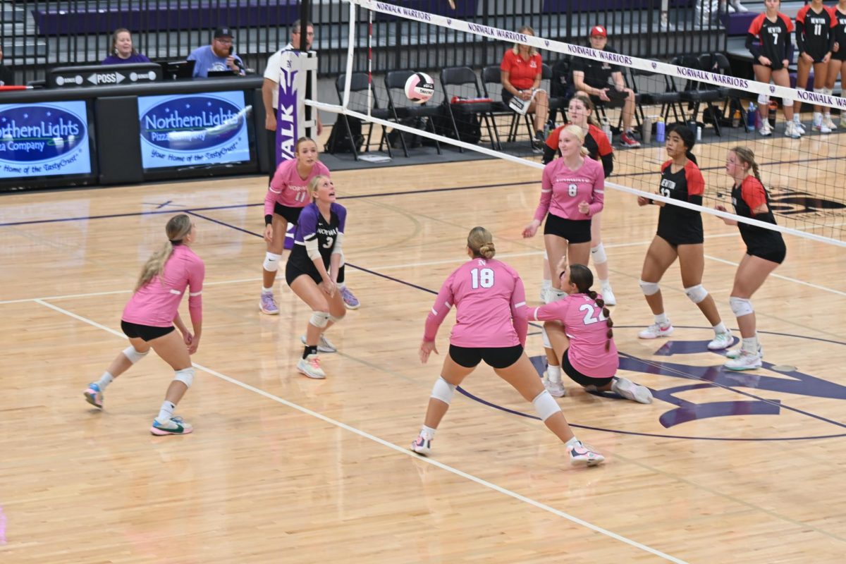 Senior Dakota Poen has her eye on the ball on Tuesday, Sept. 20, in the game against Newton in the NPECC. The Warriors will face Pella on Tuesday, Sept. 24, for Senior Night.