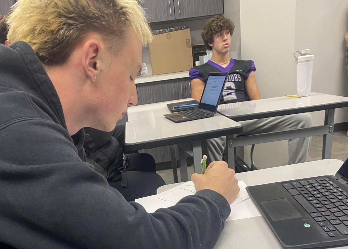 Senior Tavin Ferner takes notes over the elections unit in Mr. Alfred's AP Government class on Friday, Oct. 25. Students in AP Government learn about elections in the weeks leading up to the general election. 