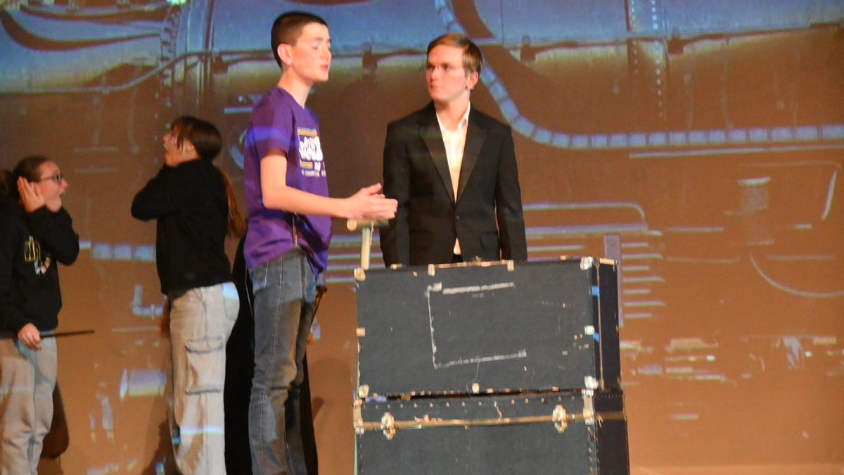 Andy DeBower (left) and Eli Geisler rehearse  on Nov. 12 in the auditorium.
During the train scene, Harry Potter (Eli Geisler) talks to his young son, Albus (Andy DeBower), about being put in the House of Slytherin.
