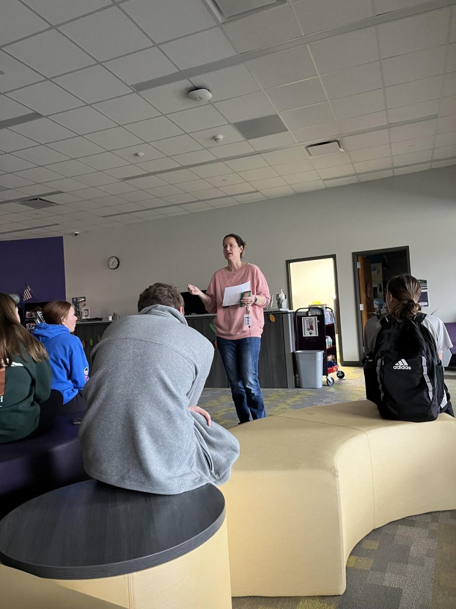 Librarian Beth Grafft explains procedures to students during a lockdown drill on Wednesday, Nov. 20, at Norwalk High School. 