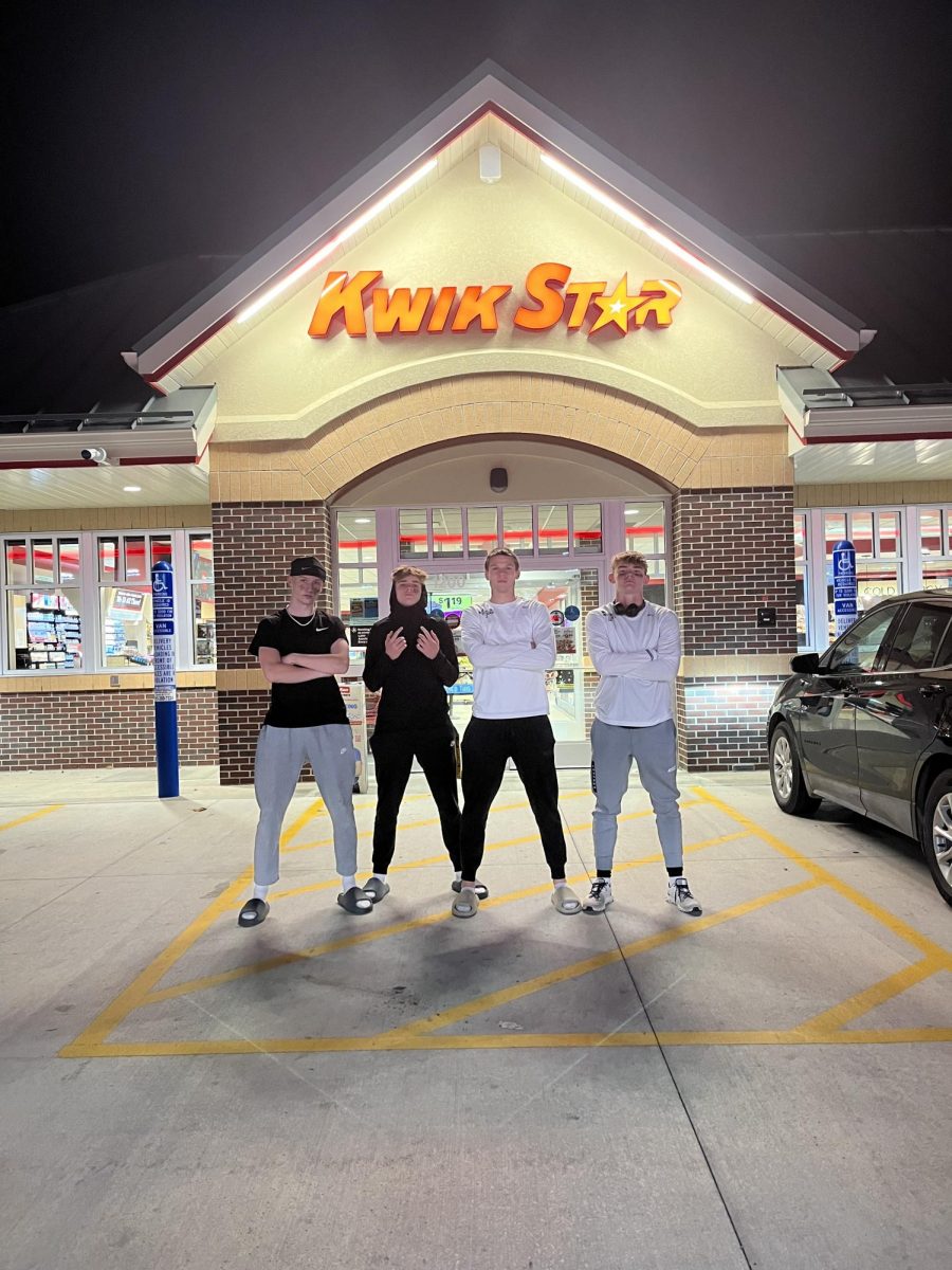 Senior Tavin Ferner (left), freshman Luke Iverson, junior Kayden Frank, and junior Xavier Bush enjoy their last time together at Kwik star after a loss against Xavier. 