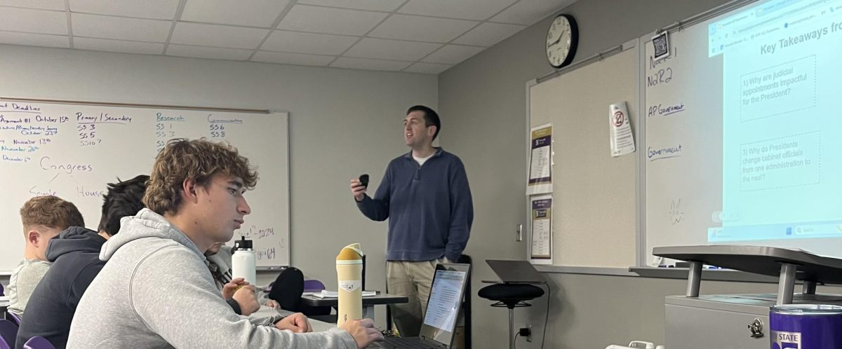 Mr. Alfred talks to his 7th hour government class on Tuesday Nov. 26 in his classroom. 