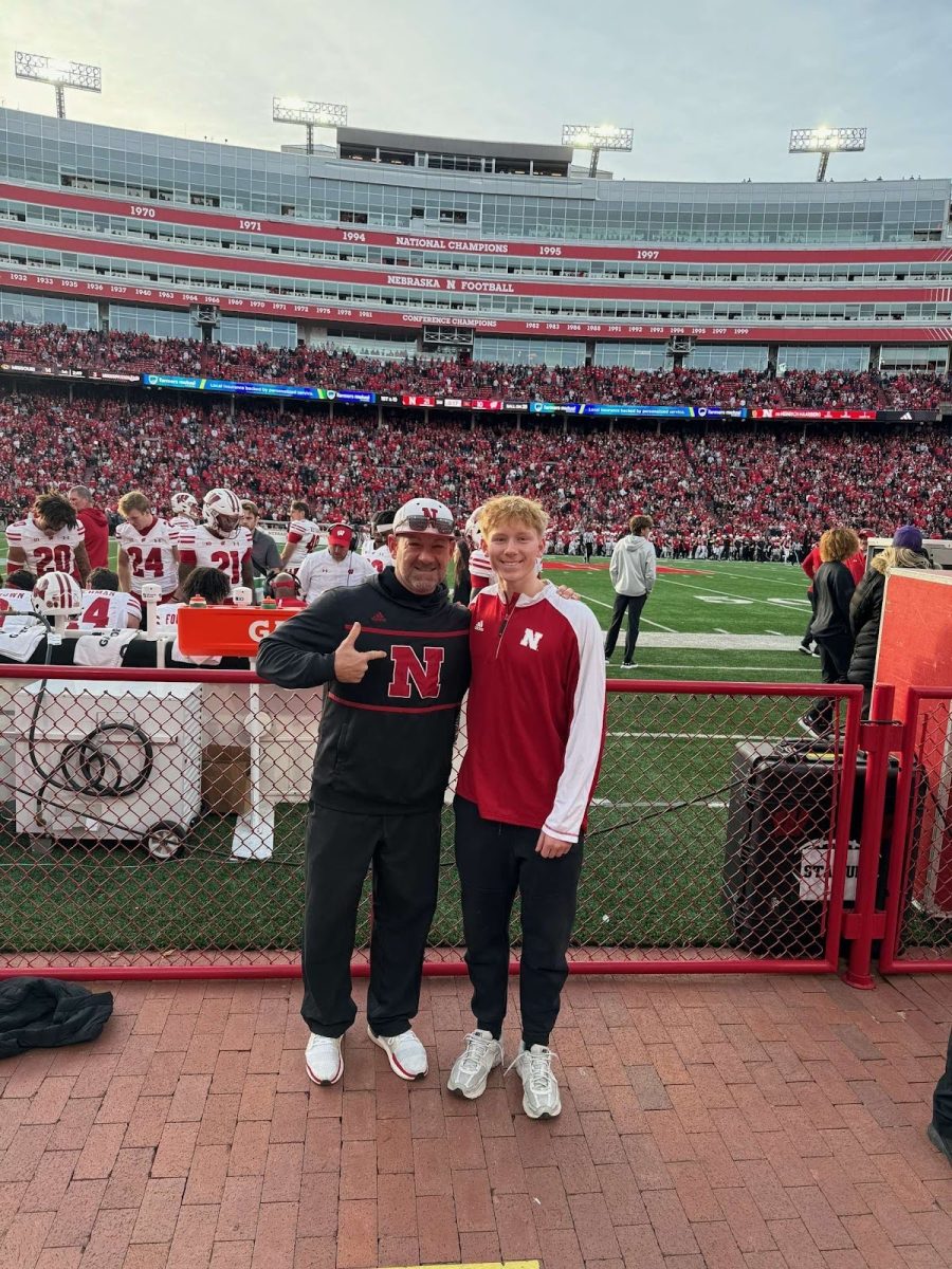 Tillman Pupcan and his father pose for a picture at Memorial Stadium, home of the Nebraska Cornhuskers. 