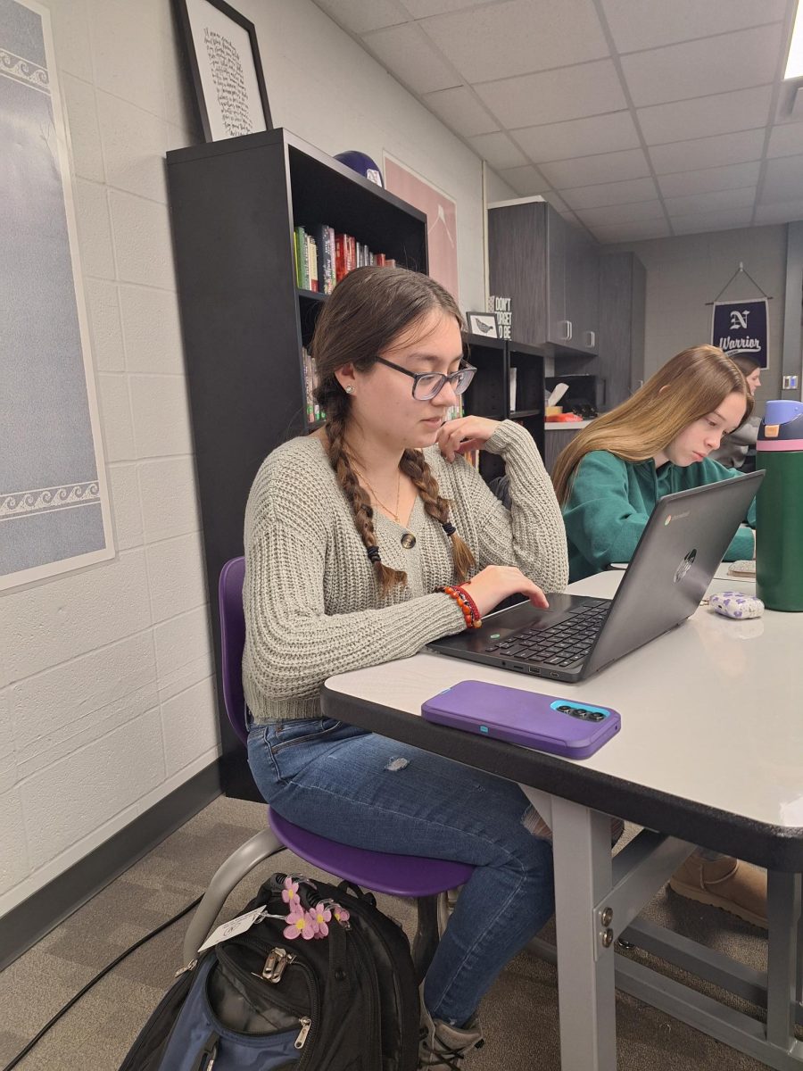 Natalia Duggan (left) works in class during 3rd period. Duggan has relatives in the California area who are currently being affected by the wildfires. 