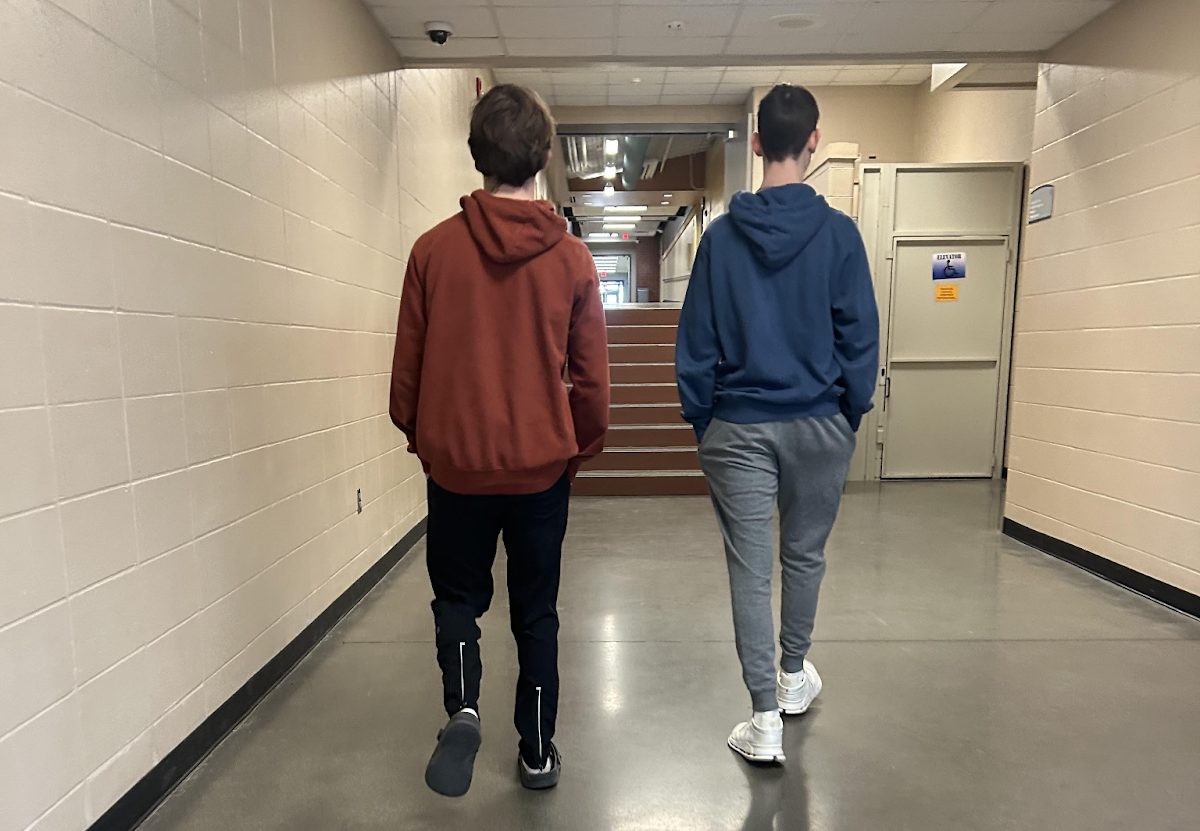 Jackson Wandrey and Joe Madonia walk down the hallway on Jan. 27 in Norwalk High School. Norwalk students returned from their long weekend  on Tuesday, Jan. 21.