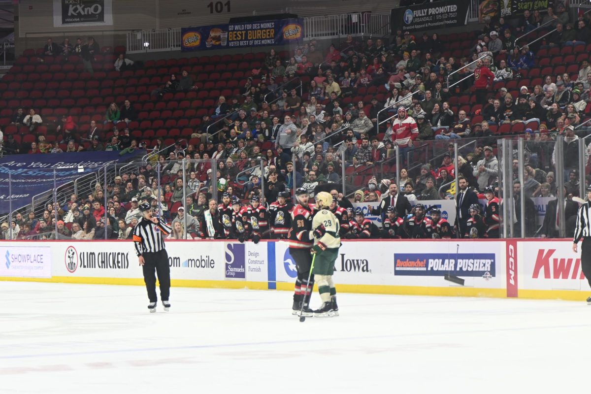 Forward Nico Blachman takes off his gloves to fight Austin Watson, but Watson doesn't drop his mitts to fight. 