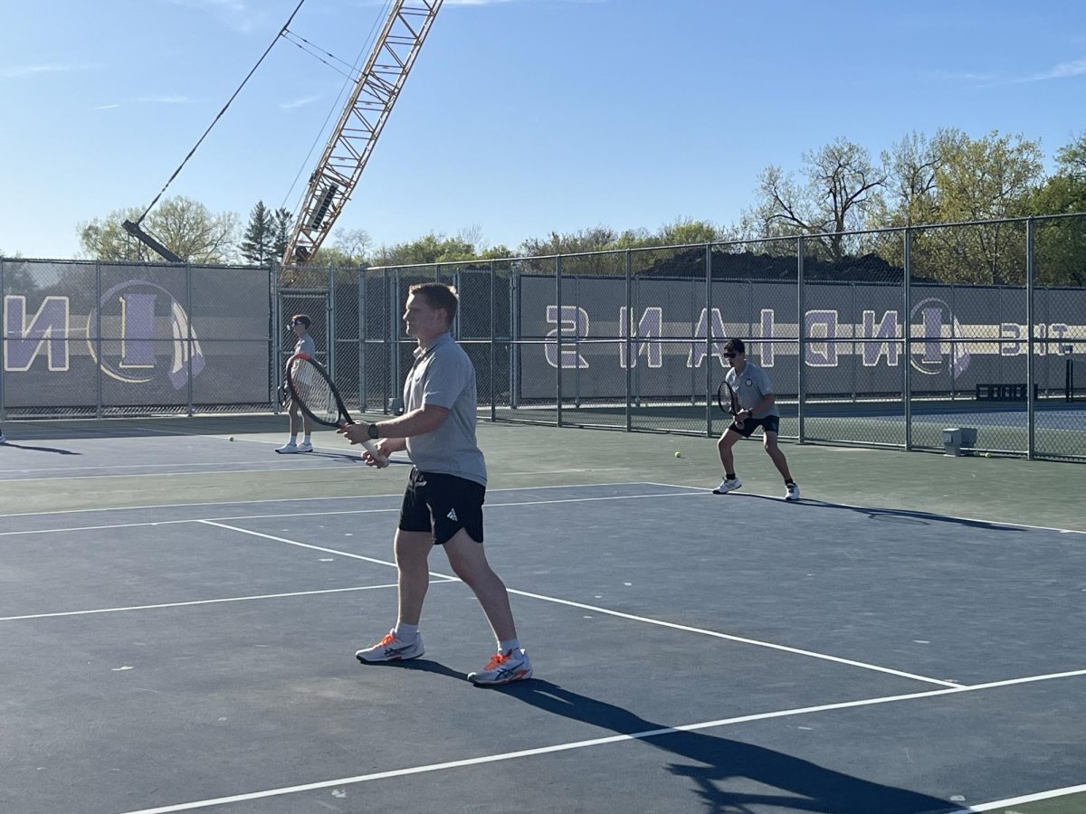 Senior Aidan Basinger (front) and freshman Alex Altes (back) play doubles against Indianola on April 29, 2025. Both Norwalk's varsity and JV teams won their meet against Indianola.