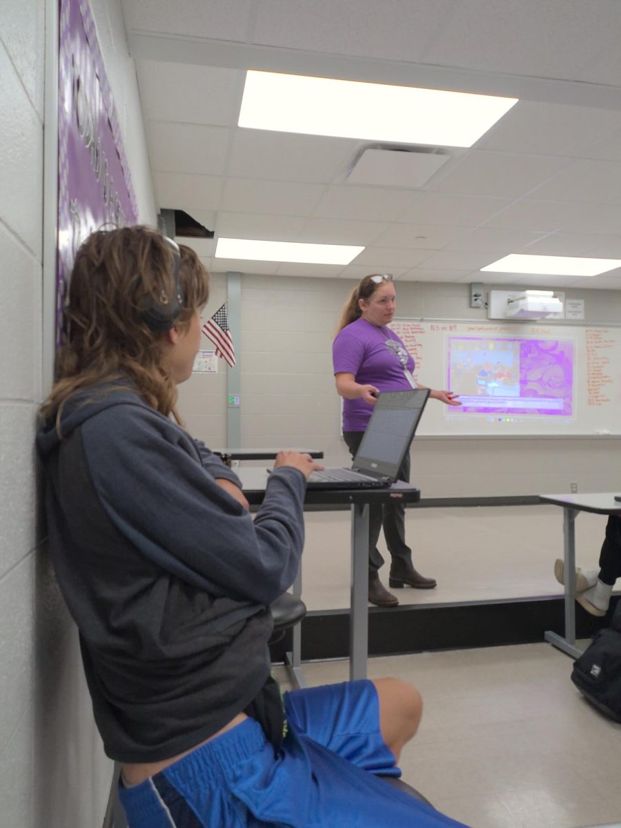 Elijah Lower (left) listens to Mrs. Thomas' lecture on Monday, Aug. 28. Mrs. Thomas started the first semester and taught about how to get a good photo and make a good cutline for the first week.