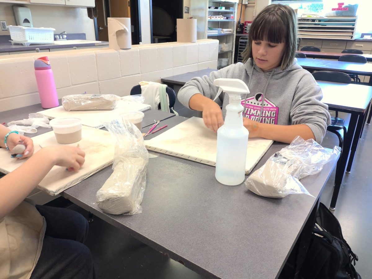Jax Rand (left) and Eva Smith play with clay for Mrs. Riemersma's art class on Aug. 29. Eva said she wanted to make a chips and salsa sculpture for her fun project.