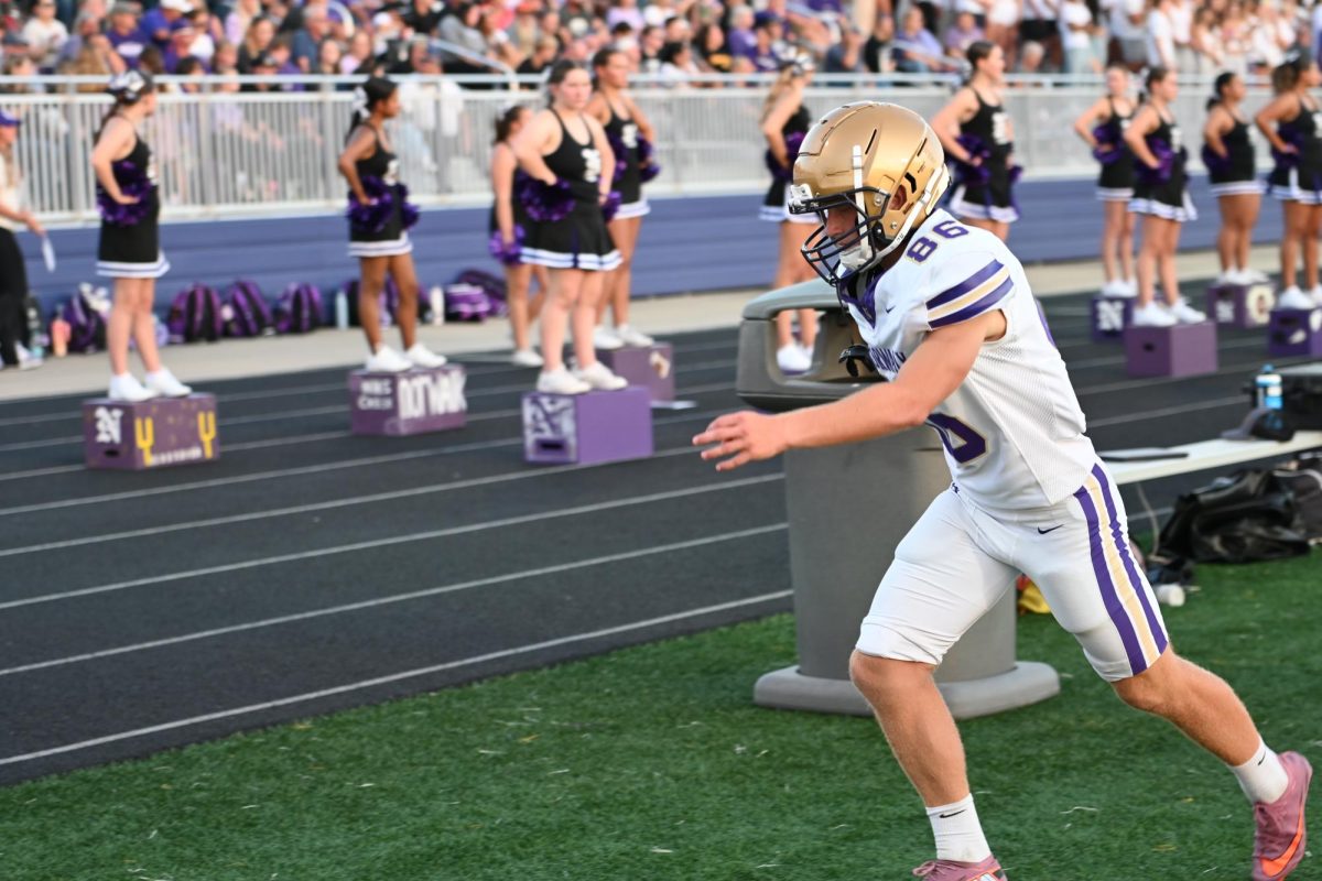 Sophomore Greer Langel practices his kicking before a field goal attempt in the second quarter against Indianola on Friday, Aug. 29, 2025, in Indianola, Iowa. In the game, he scored all the extra points in the game.