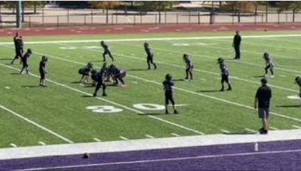 A youth football team plays recently at Norwalk Warrior Stadium. Third- through sixth-grade football players will be recognized at the Norwalk High School football game for Youth Night on Friday, Aug. 12.