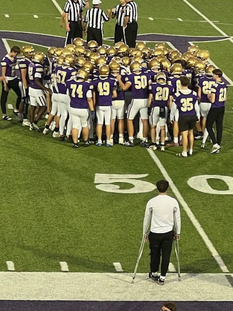 The Warriors huddle pregame before the opening kickoff. The Warriors were coming off a win at Iowa City High.
