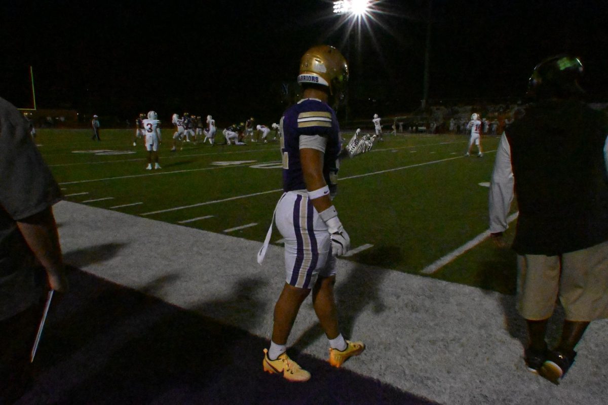 Junior Victor Esparza watches the offense in the third quarter of the Homecoming game on Oct. 3, 2025. In the winning effort against the East Scarlets, Esparza recorded  2.5 total tackles and 2 solo.
