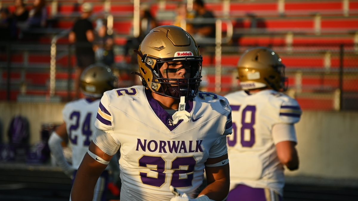 Victor Esparza does high-knee karaoke during warm-ups at Iowa City. Esparza is a two-year starter at linebacker.