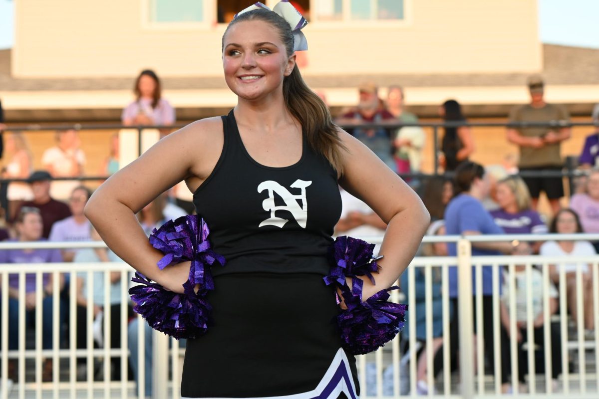 Allison Garrison cheers for the Norwalk Football Team on Friday, Aug. 29, during their game against Indianola. Tonight Norwalk will play its Homecoming game against Des Moines East.