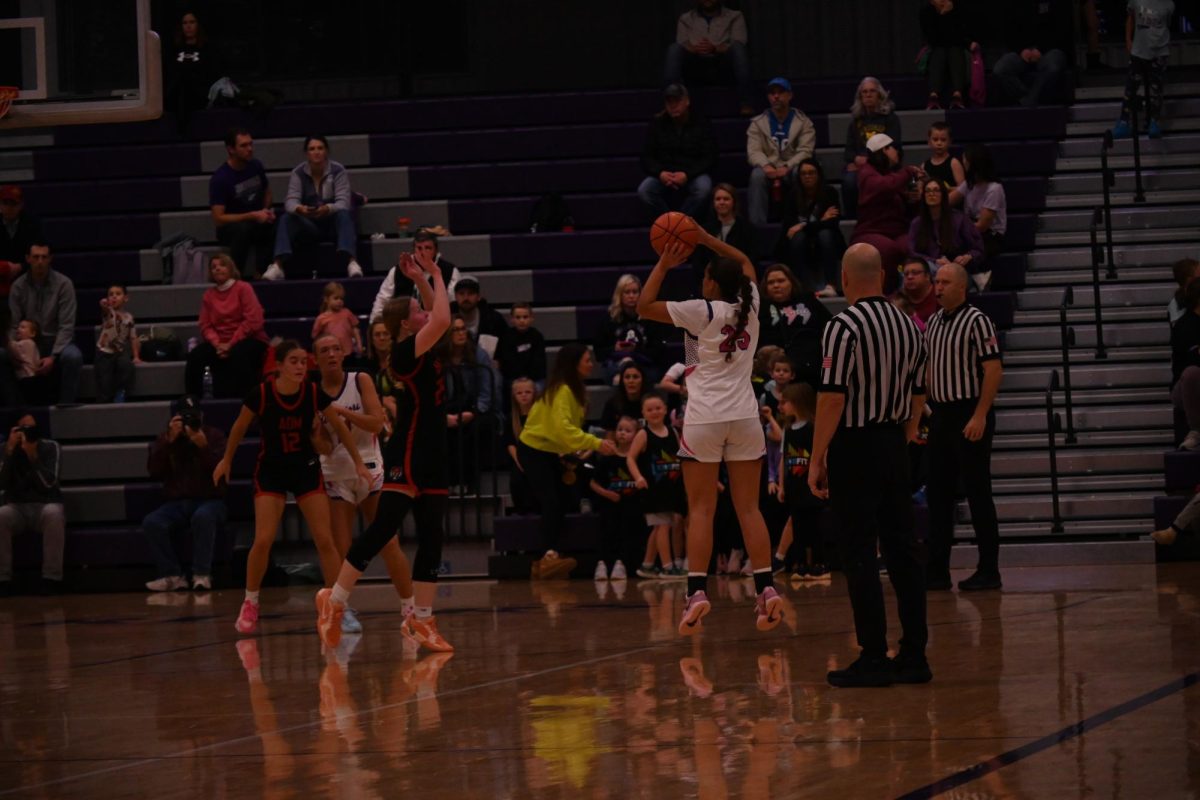Sophomore Grace Bordenaro shoots a three-point shot in the second quarter on Nov. 24, 2025. In the winning efforts against ADM and Bondurant-Farrar, she recorded 8 points, 7 rebounds, and 4 assists.