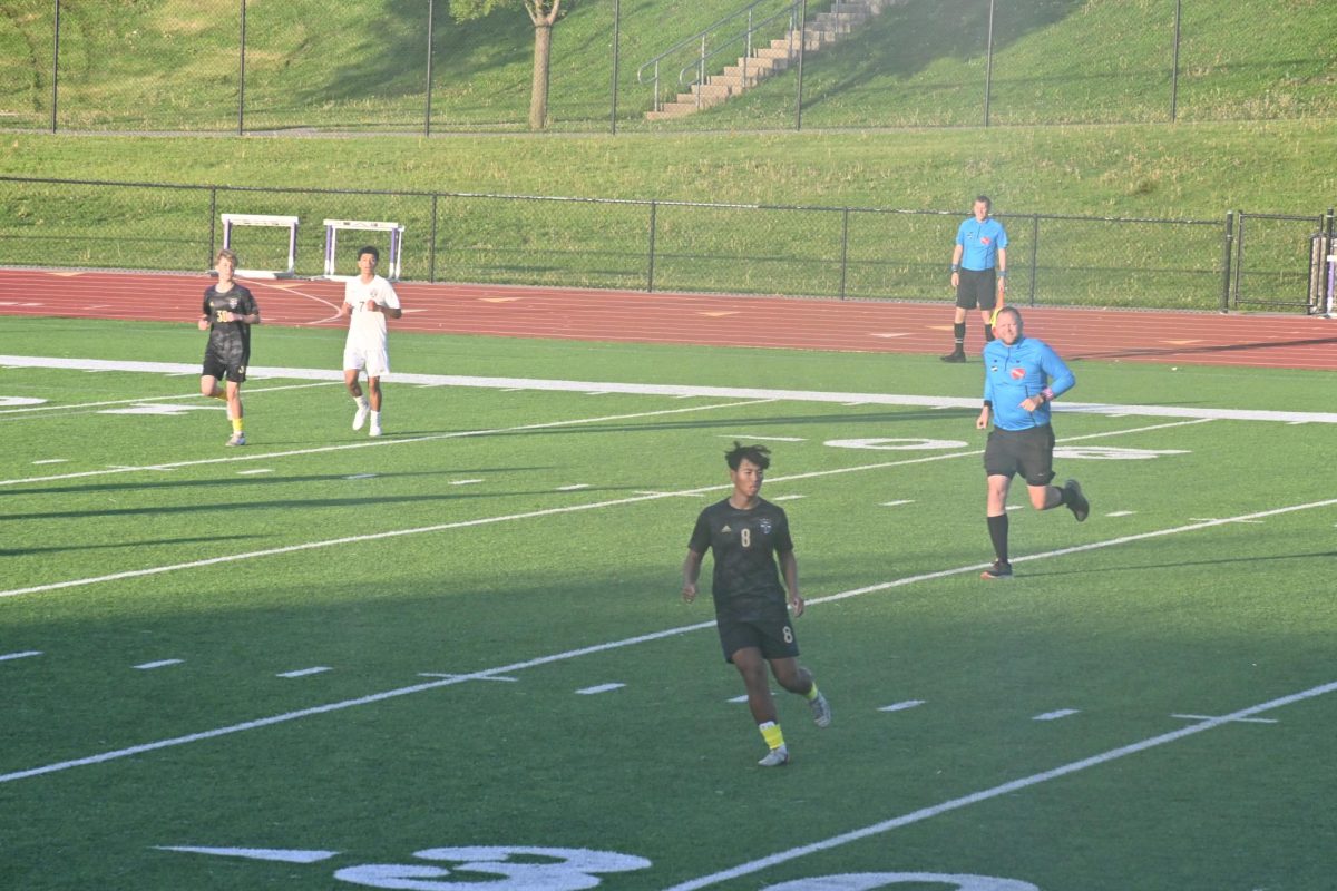 Tyden Eng (center) plays hard in the game against Dowling Catholic High School on May 9, 2025. Both the girls and boys soccer teams will play their home opener tonight at Mineart Field.