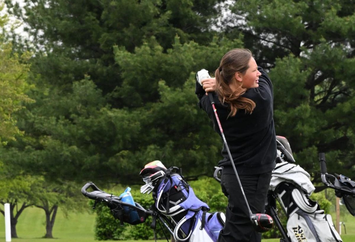 Junior Evelyn Kinney swings the wood at the Southeast Polk Invitational on May 7, 2026. In that round, the team shot 353 and finished in fifth place.