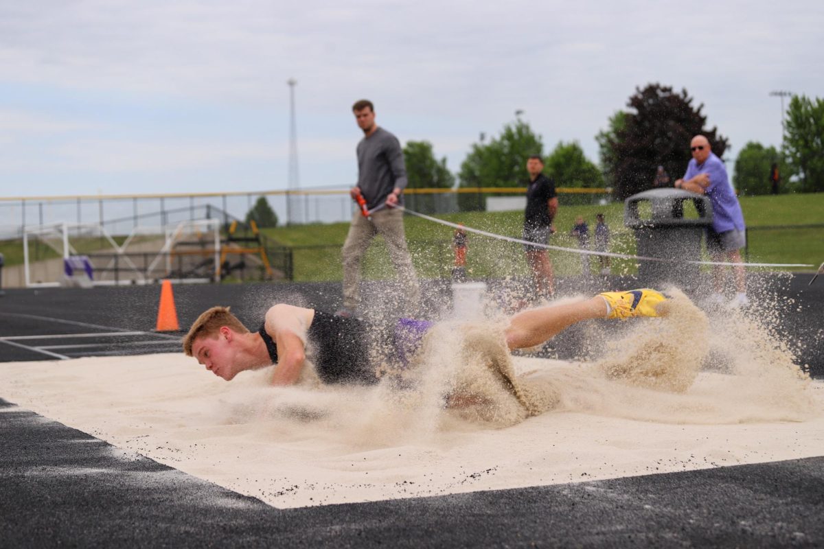 Kaiden Kunze long jumps during the State Qualifying Meet at Indianola. Kunze leads in the state in the long jump at 24' 5".