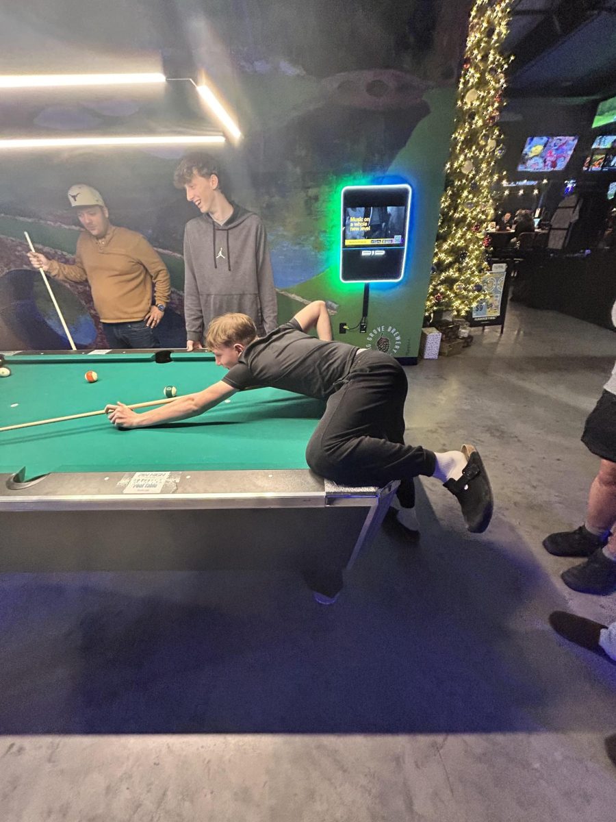 Abram Rosenberg shoots pool recently at Pin High Sports Bar in Norwalk. A group of teenage boys has taken up pool as a hobby.